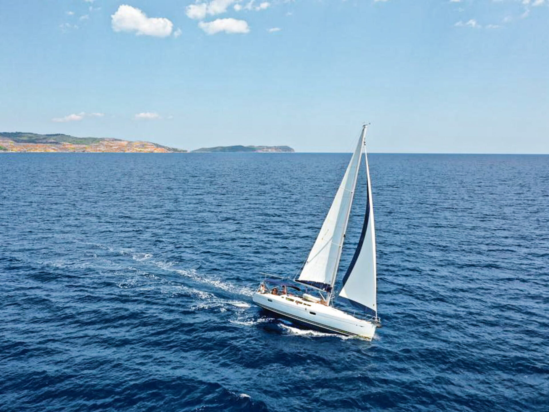 Sailing yacht in fair winds