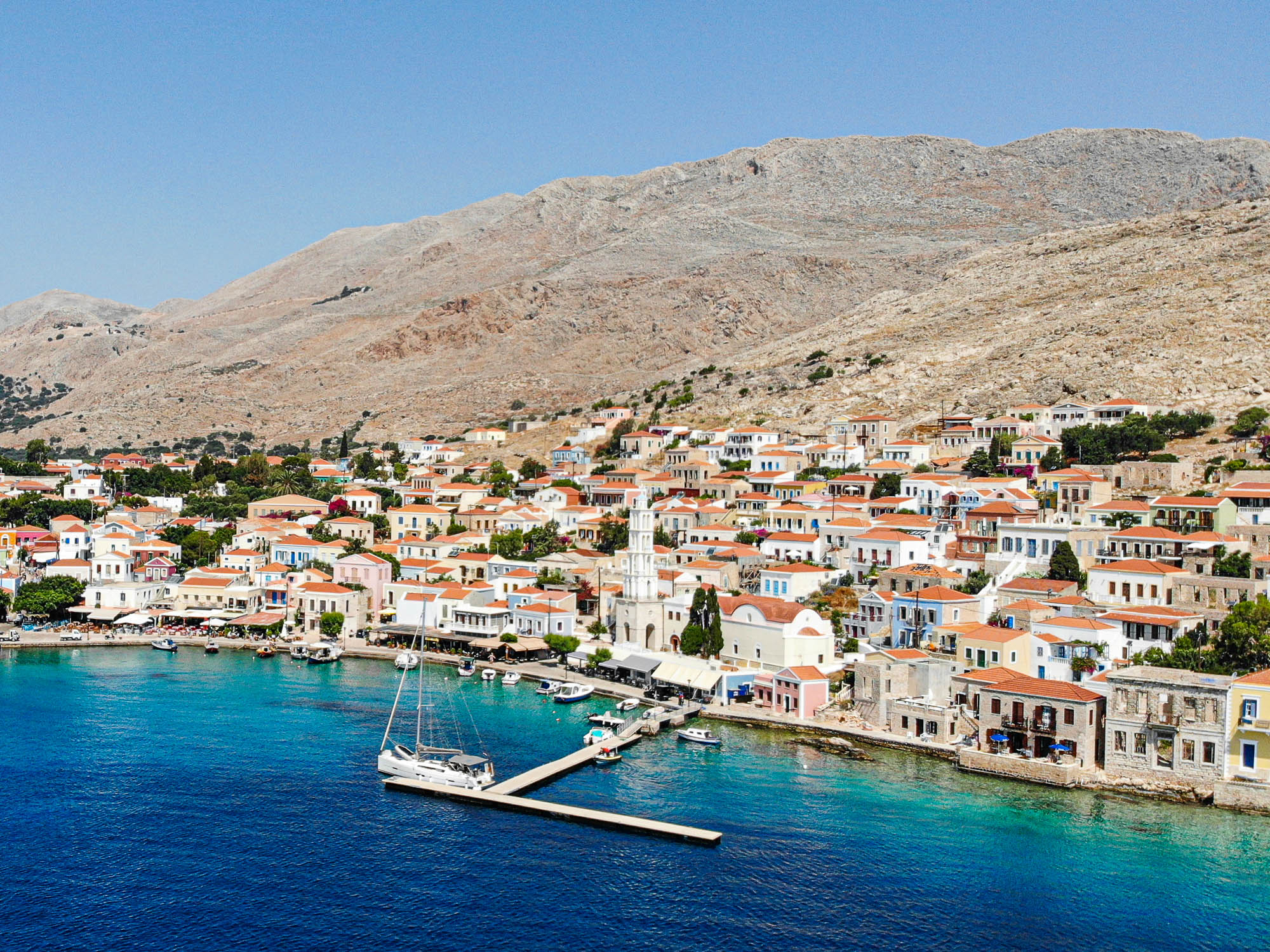 Greek island with sailing yacht